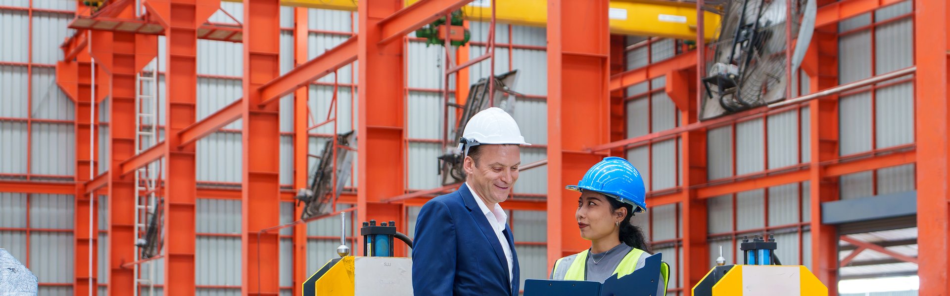 ISO compliance auditor inspecting site setup and safety signage