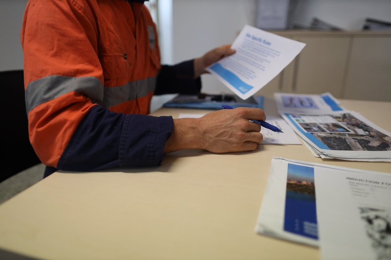 Operative receiving safety induction check before site clearance